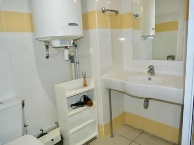 a bathroom with a sink and a toilet and a mirror at Le Clos d'AIX Studio 113 in Aix-en-Provence