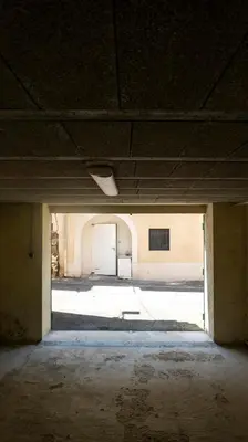 an empty room with a white door in a building at Duplex en centre ville avec un Garage privé in Salon-de-Provence