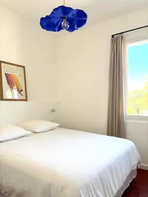 a bedroom with two beds and a blue ceiling at Maison Poumo, Piscine, clim & padel privé,12 pers in LʼIsle-sur-la-Sorgue