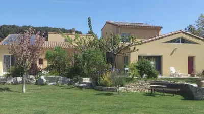 a house with a garden in front of it at La bergerie in Cadenet