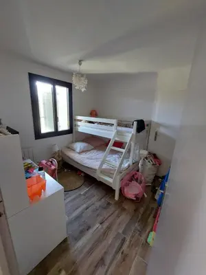 a small room with a bunk bed and a floor at Mas Saint André 3 étoiles au cœur de la Provence in Saint-Andiol