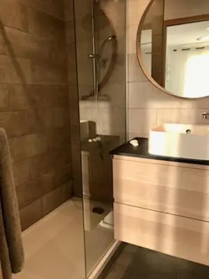 a bathroom with a shower with a sink and a mirror at Maison entière avec jardin à 5 mn centre ville Aix en Provence in Aix-en-Provence