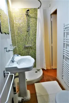 a bathroom with a sink and a shower at La Cachette centre historique village in Roussillon