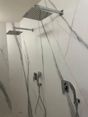 a shower in a bathroom with marble walls at Le Fort 6 - Appartement neuf 6p in LʼIsle-sur-la-Sorgue