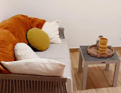 a living room with a couch and a table at Studio MAREVA in Cavaillon