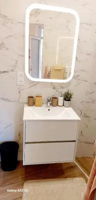 a bathroom with a white sink and a mirror at Studio MAREVA in Cavaillon
