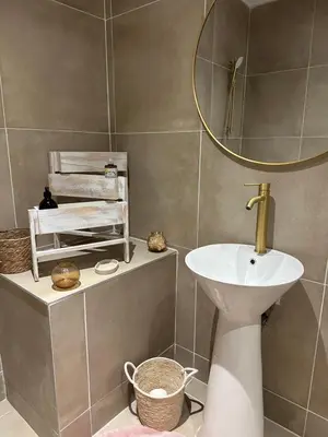 a kitchen with a stove and a counter top at Bel appartement 1er étage au centre ville de Carpentras in Carpentras