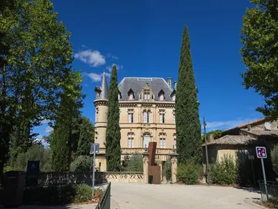 a large castle with trees in front of it at Village House in Pélissanne near Luberon in Pélissanne