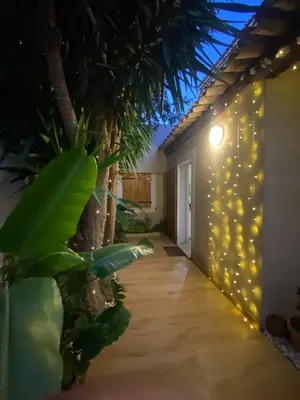 a room with a wall with lights on it at Tiny House - Les Baïsses - Jardin Tropical in Lançon-Provence