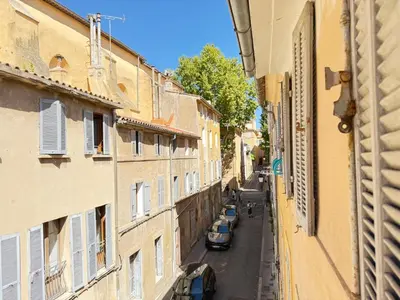 an alley with cars parked on a street between buildings at Refuge reposant - Centre ville - Espace Bureau in Aix-en-Provence