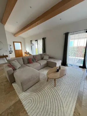 a living room with a couch and a coffee table at House with a view of Luberon and a pool in Maubec