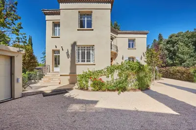 a house with a driveway in front of it at Appartment 5 min walking from city center in Aix-en-Provence