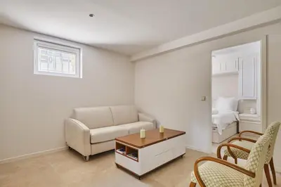 a living room with a couch and a table at Appartment 5 min walking from city center in Aix-en-Provence