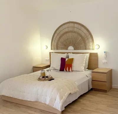 a bedroom with a large bed with two night stands at Le Quatre Relax in Aix-en-Provence