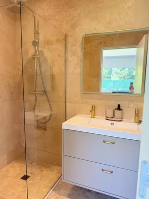 a bathroom with a shower and a sink and a mirror at Le Quatre Relax in Aix-en-Provence