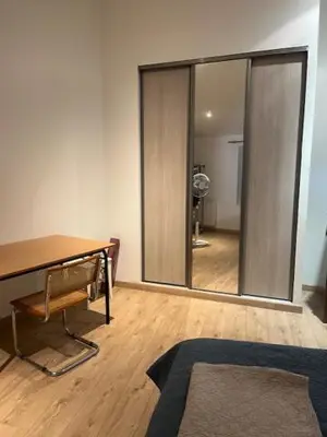 a room with a desk and a large mirror at Suite dans maison de village au coeur de Pertuis in Pertuis