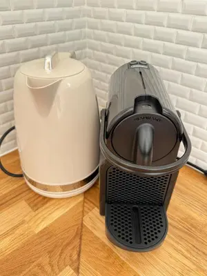 a toaster and a coffee maker on a table at Escapade Provençale 5 in Aix-en-Provence