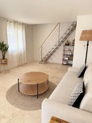 a living room with a couch and a coffee table at Appartement Confortable en Provence in Aix-en-Provence