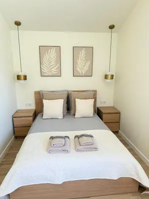 a bedroom with a bed with two towels on it at Appartement Confortable en Provence in Aix-en-Provence