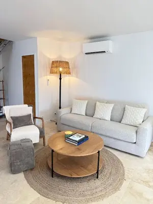 a living room with a couch and a coffee table at Appartement Confortable en Provence in Aix-en-Provence