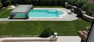 an overhead view of a swimming pool in a yard at le Jardin de Flore in Manosque