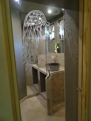 a bathroom with a sink and a mirror at Mas D'Ange en Provence in Les Taillades