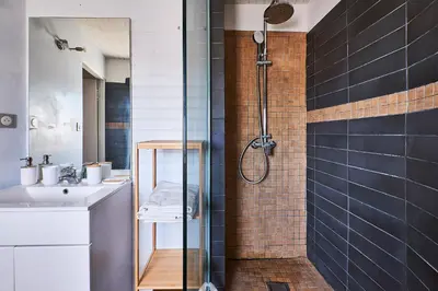 a bathroom with a shower and a sink at Le Fort de Bramafan in Caumont-sur-Durance