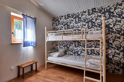 a bedroom with two bunk beds in a room at Le Fort de Bramafan in Caumont-sur-Durance