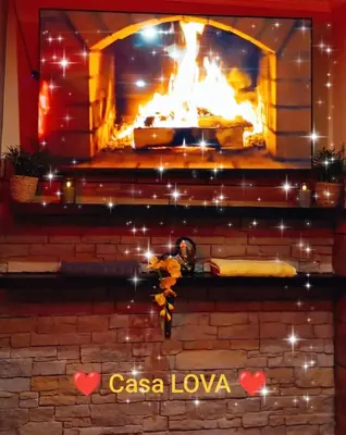 a brick fireplace with a fire in it at Casa Lova Spa Privé, Clim,Baignoire balnéo in Entraigues-sur-la-Sorgue