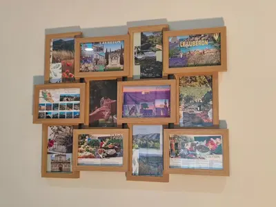 a group of pictures hanging on a wall at Escapade dans le Luberon in Cavaillon