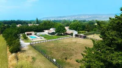an aerial view of a house with a large yard at Mas Provençal chic et élégant - Alpilles et Luberon in Sénas