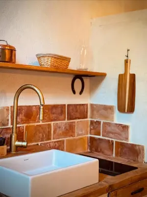 a kitchen with a sink and a counter top at Le mazet du cavalier in Puyvert