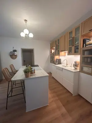 a kitchen with white cabinets and a white counter top at Villa de Seytres in Caumont-sur-Durance