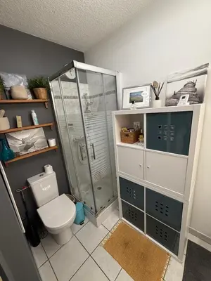 a bathroom with a toilet and a glass shower at studio calme campagne in Aix-en-Provence