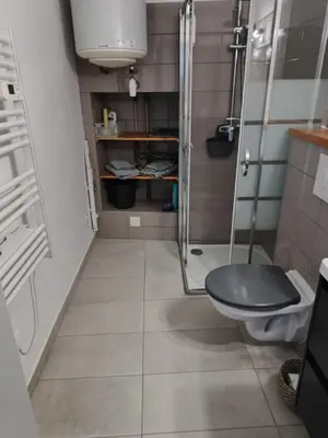 a small bathroom with a shower and a toilet at L'escale Cavaillonnaise in Cavaillon