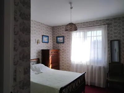 a bedroom with a bed and a window at Vaste villa , piscine , garage pour vélos et motos , grand parking in Caromb