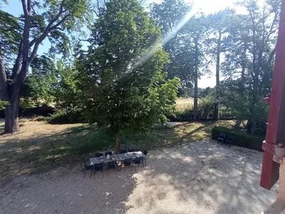 a house in the middle of a yard with trees at Maison de famille dans les amandiers Provence 15 prs - Domaine de Ribbe in Rognes