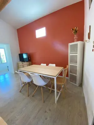 a dining room with a table and chairs at L appartement Lambescain in Lambesc