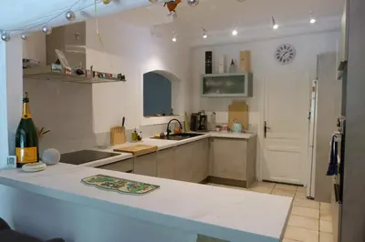 a kitchen with a sink and a counter top at Villa Au Coeur Du Luberon in Maubec