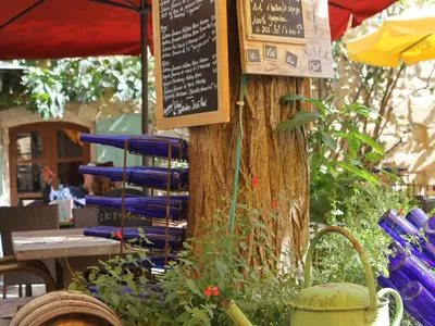 a tree with a sign attached to a tree at Attractive Holiday Home in C reste with Pool in Céreste