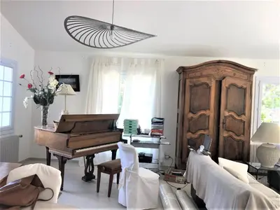 a living room with a piano and a couch at Attractive Holiday Home in C reste with Pool in Céreste