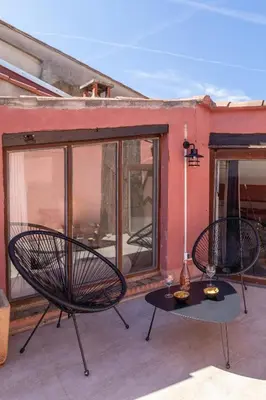 two chairs and a table on a patio at Duplex avec terrasse, au cœur d'Aix-en-Provence in Aix-en-Provence