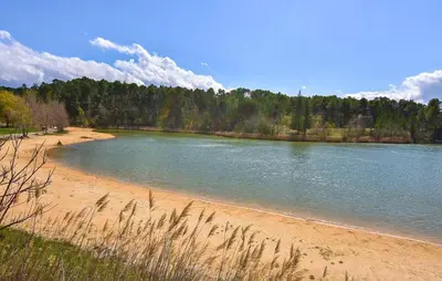 a beach with a large body of water at Maisonnette Avec Jacuzzi in Mazan