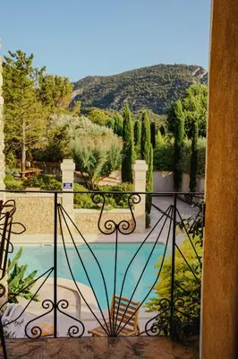 a view of a garden from a balcony at Charming House At The Foot Of Luberon In Maubec in Maubec