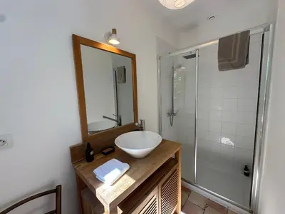 a bathroom with a sink and a shower at Villa des Platanes - Maison provençale avec jardin, parking & barbecue au cœur du vignoble du Château de Barbebelle Rognes - Proche Aix-en-Provence - 6 personnes in Rognes