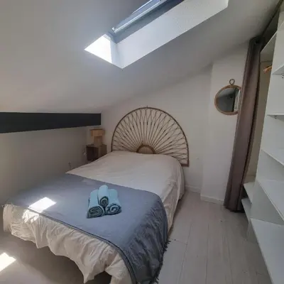 a kitchen with white cabinets and a microwave at L'Etreinte Bleue de Provence in Eyguières