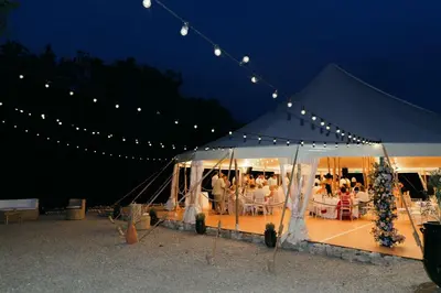 a tent with a group of people sitting at tables at Maison du Berger - Vignoble Château Barbebelle, Rognes, maison provençale avec jardin partagé et parking - proche d'Aix-en-Provence - 5 personnes in Rognes