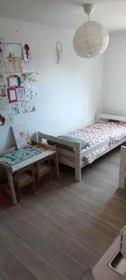 a bedroom with a large bed and a desk at Chic & Cozy 95m Apartment Perfect for Families in Aix-en-Provence