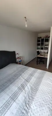 a living room with a white couch and a table at Chic & Cozy 95m Apartment Perfect for Families in Aix-en-Provence