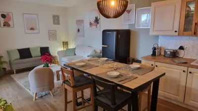 a porch with chairs and tables and a patio at Appartement golf saumane Celomidie in Saumane-de-Vaucluse
